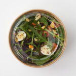flat-plastic-lid-for-salad-bowl-above-on-bowl
